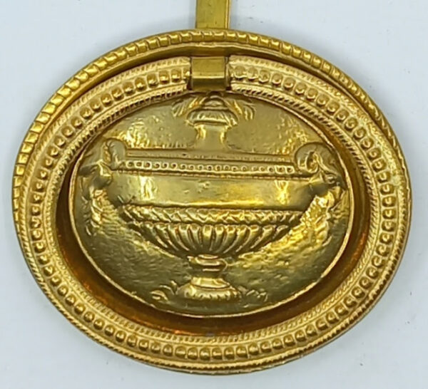 Poignée laiton 24.701.1  bronze Ls XVI, poli, dim. 65x58mm, attache à lacet.