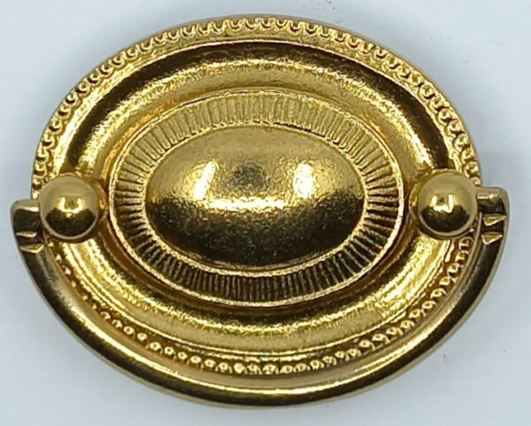 Poignée laiton 24.719.1   bronze Ls XVI, poli, dim. 64x51mm.