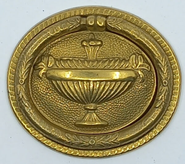 Poignée laiton 24.721.1   bronze Ls XVI, poli, dim. 63x53mm.