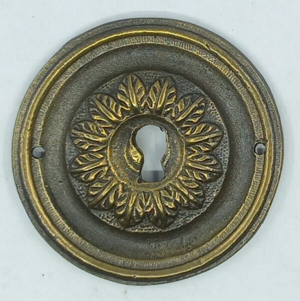 Entrée laiton 20.655.1 bronze patiné, diam.56mm, Empire.