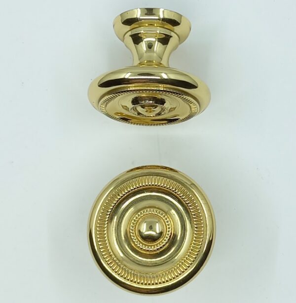 Bouton laiton 14.149  Empire, poli et verni, diam. x H  25x21 et 32x25mm.