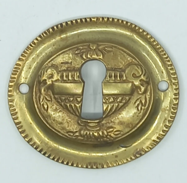 Entrée laiton 20.582.1 bronze, patiné,  Louis XVI, 43x50mm.