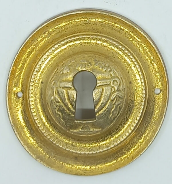 Entrée laiton 20.580.1 bronze, patiné,  Louis XVI,  diam.53mm.