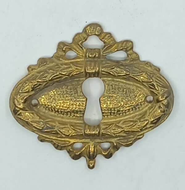 Entrée laiton 20.584.1 bronze, poli,  Louis XVI, 40x47mm.