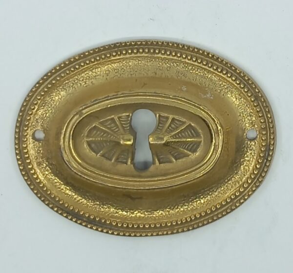 Entrée laiton 20.592.1 bronze, patiné,  Louis XVI, 50x70mm.