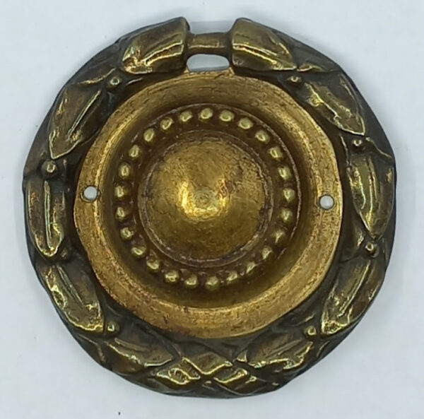 Poignée laiton 24.745.1   bronze Ls XVI, patiné,  diam. 57mm, à lacet.