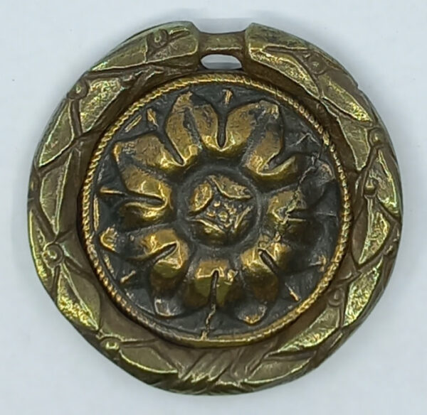 Poignée laiton 24.744.1   bronze Ls XVI, patiné,  diam. 55mm, à lacet.